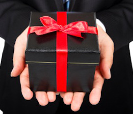 Business Man Holding a Gift Package in Hand
